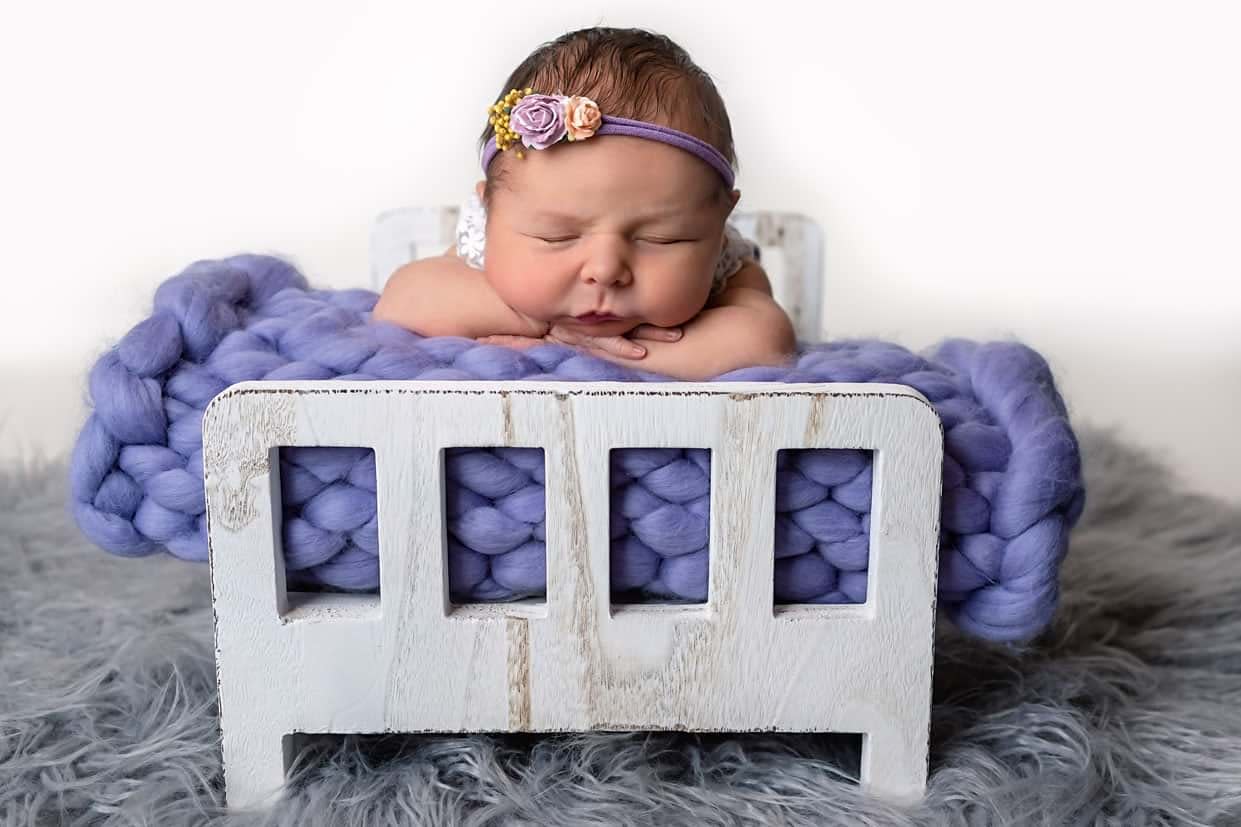 Lomax-Photography-Heywood-Lancashire-Manchester-Newborn-1 Purple Sleeping Newborn Baby In Bed In Heywood